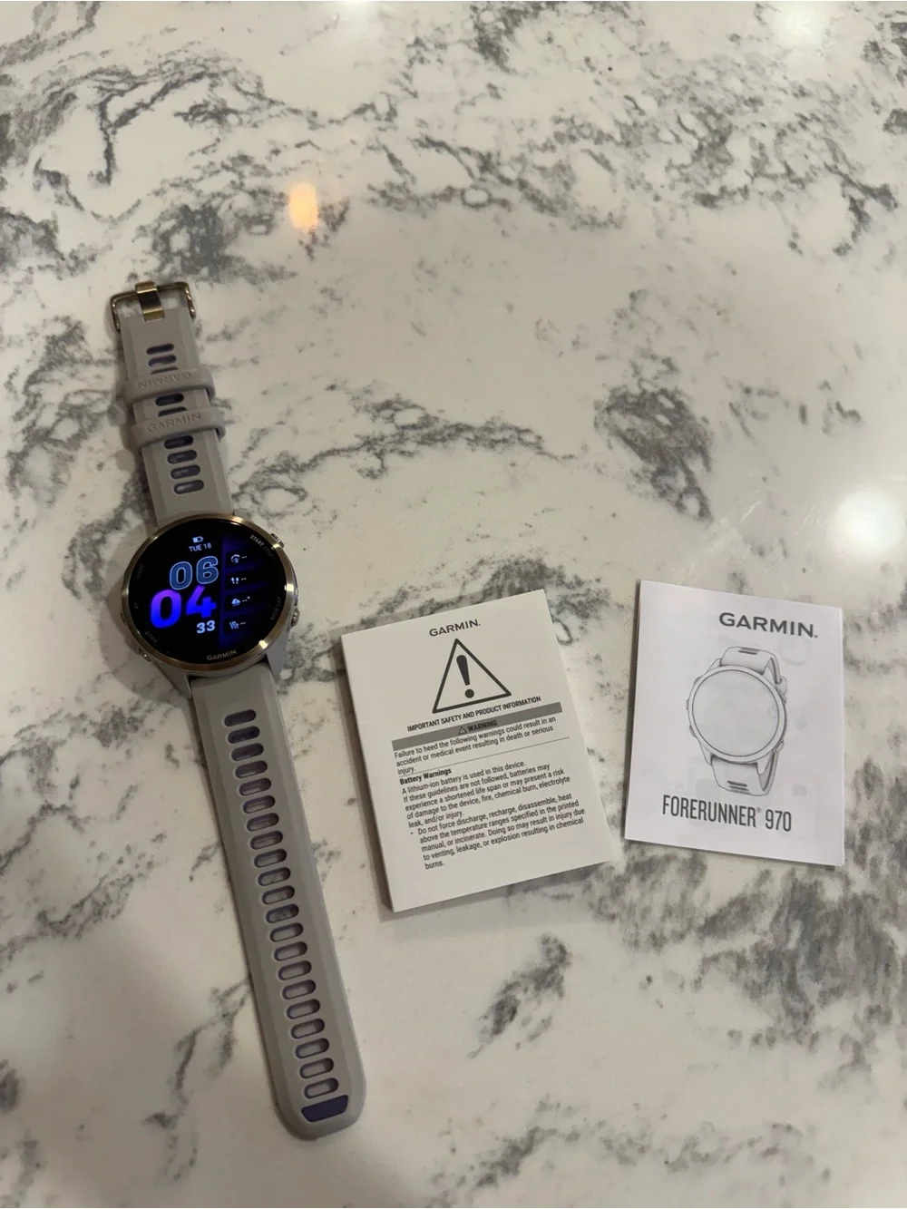 garmin Forerunner 970 Smartwatch - Soft Gold Titanium with French Gray Case